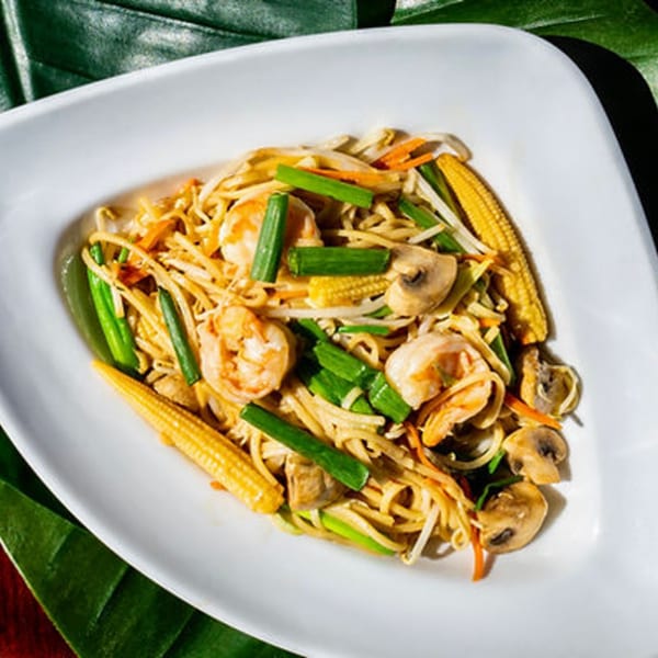 Thailicious' Pad See Ew with shrimp, noodles, baby corn, mushrooms, and green onions.